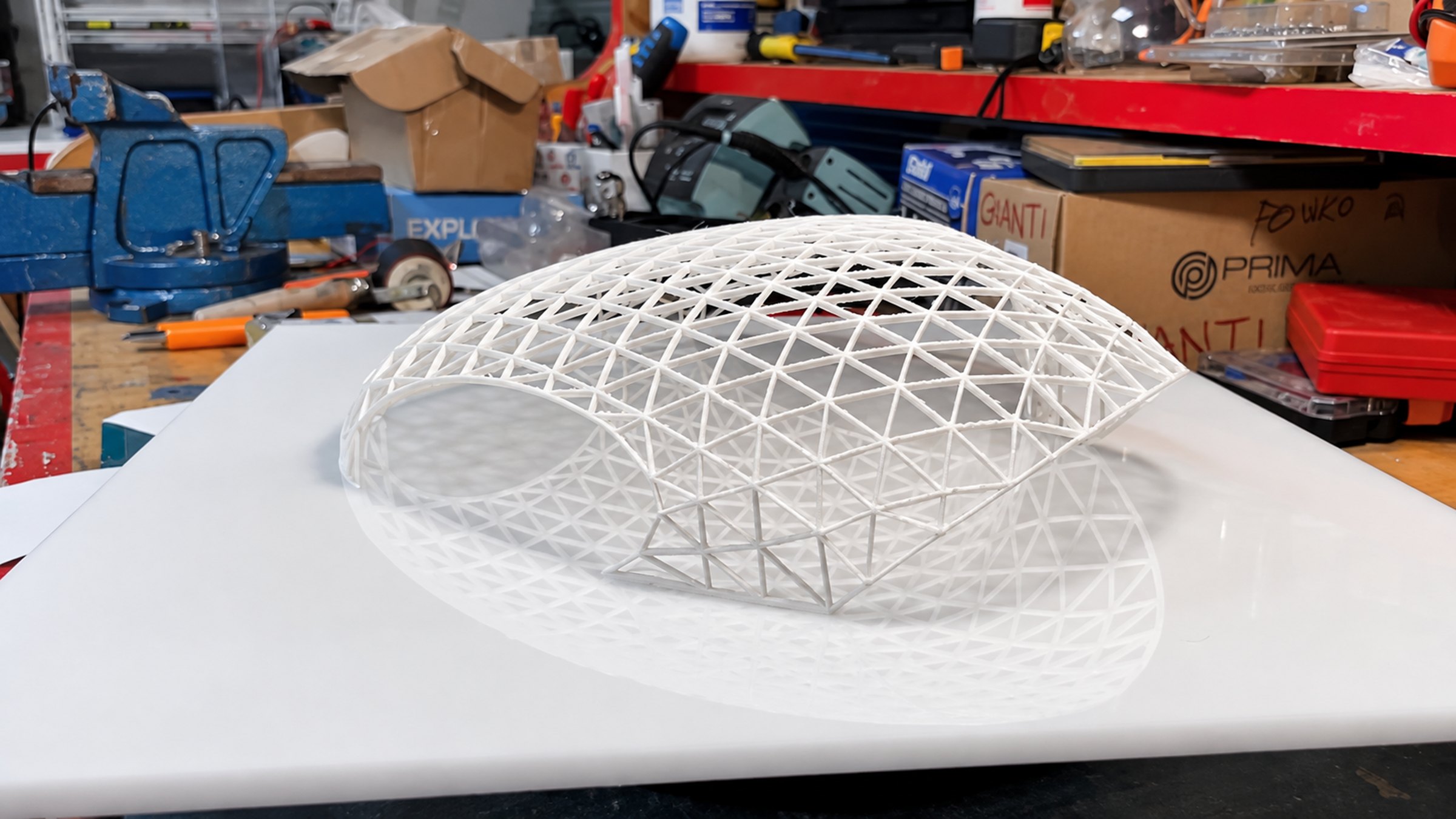 Nir Sivan Architects – REUT Heart social piazza, Jerusalem, Israel: 3D-printed model of the gridshell canopy on the studio workbench