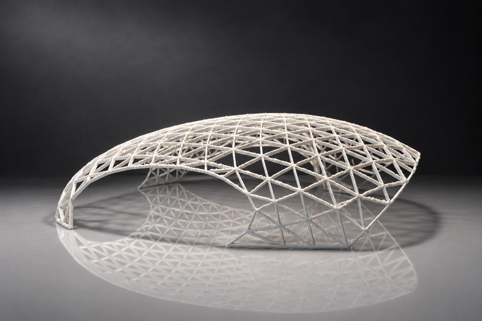 Nir Sivan Architects – 3D-printed model of the REUT Heart gridshell canopy (2025): the dome with its two openings, seen from the side