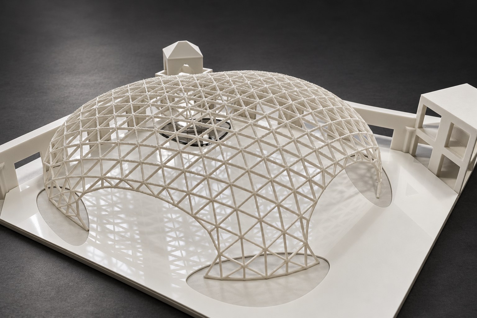Nir Sivan Architects – 3D-printed model of the REUT Heart gridshell canopy (2025): the dome on the white site model, seen from above